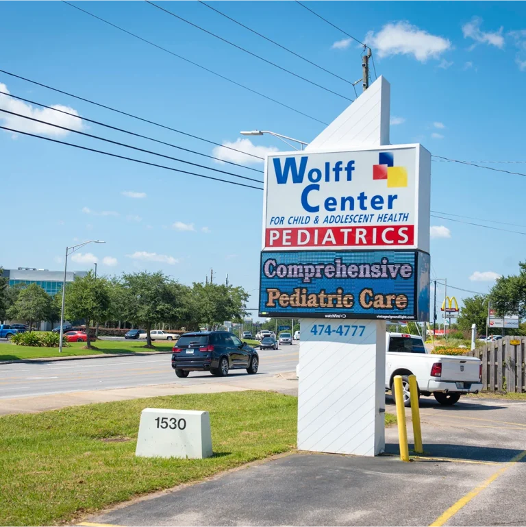 Side angle of Watchfire LED display installed by Vintage Sign & Light for pediatric clinic signage