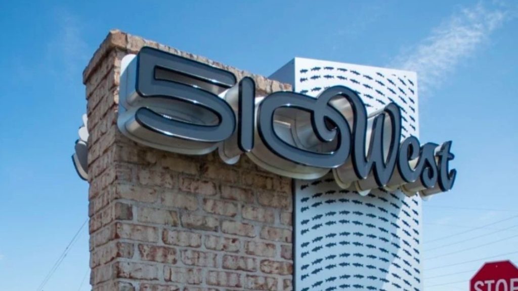 Custom brick and panel monument sign for 510 West, showcasing dimensional lettering and modern design elements, an example of high-quality work by monument sign companies in Florida.