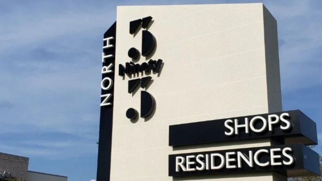 Contemporary architectural monument sign for North 93 featuring dimensional lettering and a clean modern design, an elegant example of high-end signage by monument sign companies in Florida.