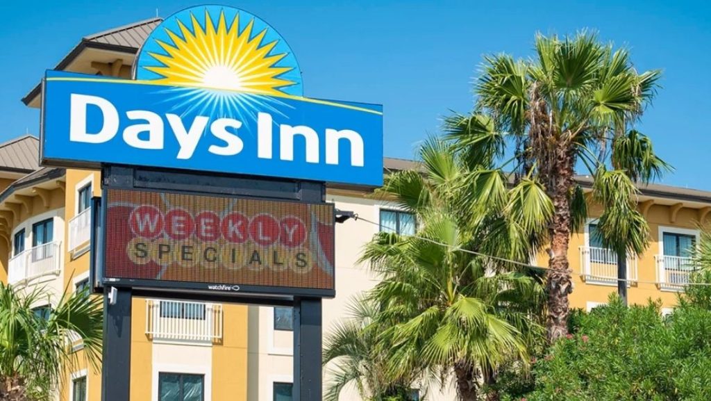 A Days Inn hotel sign featuring a bright LED display promoting weekly specials, demonstrating the use of digital signage solutions for hospitality businesses.