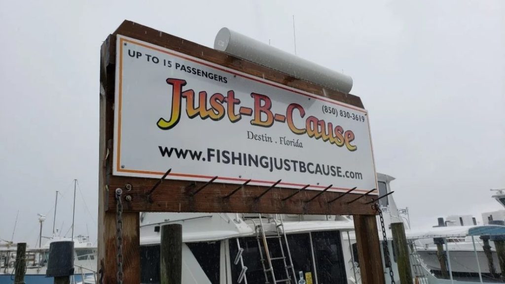 Just-B-Cause fishing charter outdoor wooden sign in Destin, Florida, large commercial signage example compared to diy signage installations.