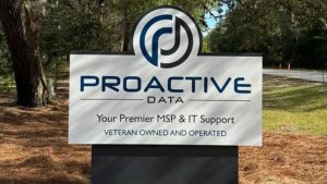 Commercial business sign for Proactive Data, an MSP and IT support company, displayed outdoors along a roadside, relevant to commercial zoning restrictions for signage placement.