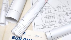 what is a signage permit shown through rolled architectural plans and building permit documents used for sign approval and construction compliance