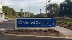 Monument sign for United Community Banking Center with a clear and professional display of the bank's name and branding, located in an outdoor setting.