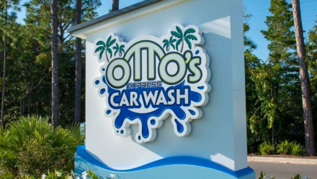 Modern monument signs with a custom dimensional Otto’s Express Car Wash logo on an outdoor roadside entrance display.