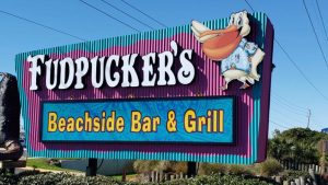 Colorful monument sign for Fudpucker’s Beachside Bar & Grill featuring large dimensional lettering