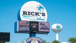 Watchfire digital display integrated into the roadside sign for Rick's Restaurant & Bar.