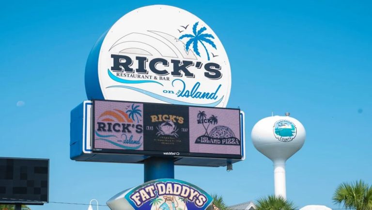 Watchfire digital display integrated into the roadside sign for Rick's Restaurant & Bar.