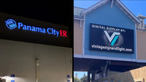 Panama City ER illuminated channel letters beside a commercial digital display sign.