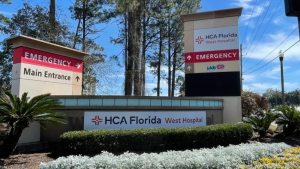 HCA Florida West Hospital pylon and monument signs at the property entrance.
